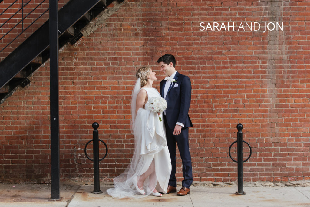 Sarah and Jon | Jessica Miller Photography bride and groom in short north columbus against brick wall