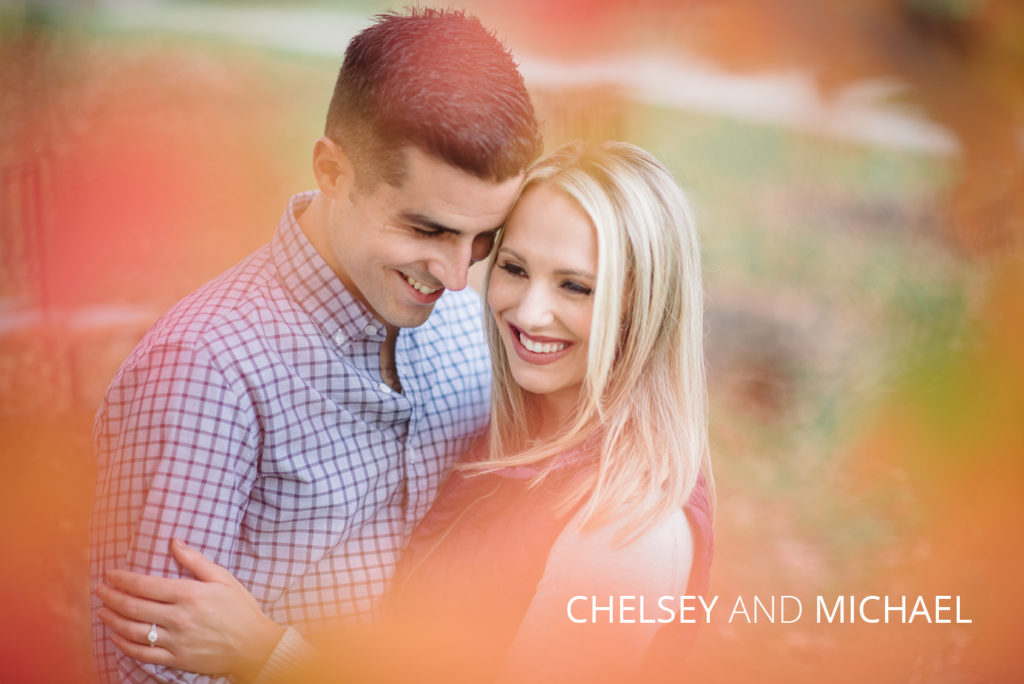 Chelsey and michael | Jessica Miller Photography couple hugging around fall leaves