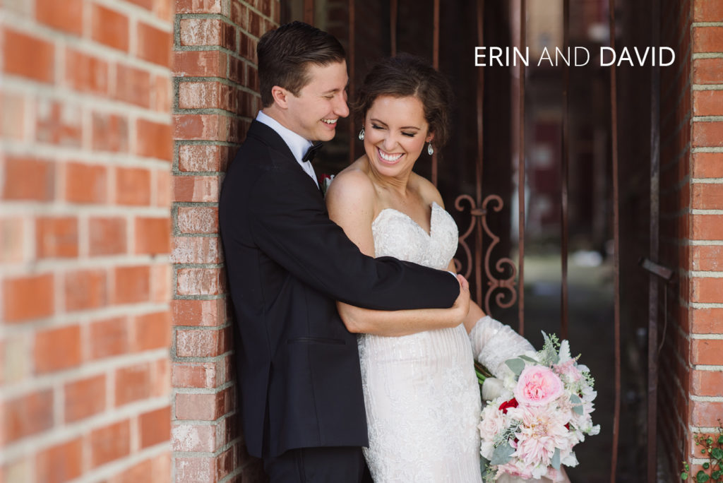 Erin david wedding | Jessica Miller Photography newlyweds hugging against a brick wall
