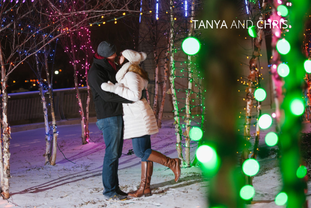 Tanya and Chris | Jessica Miller Photography married couple kissing among holiday lights