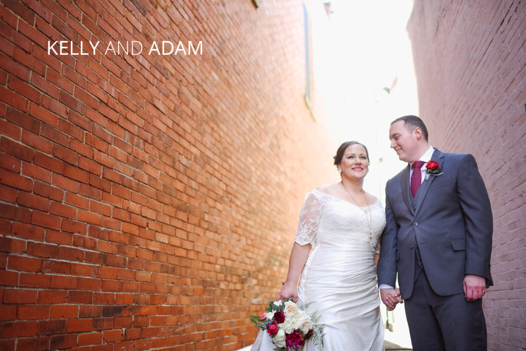 kelly and adam wedding | Jessica Miller Photography couple in rustic alley on their wedding day