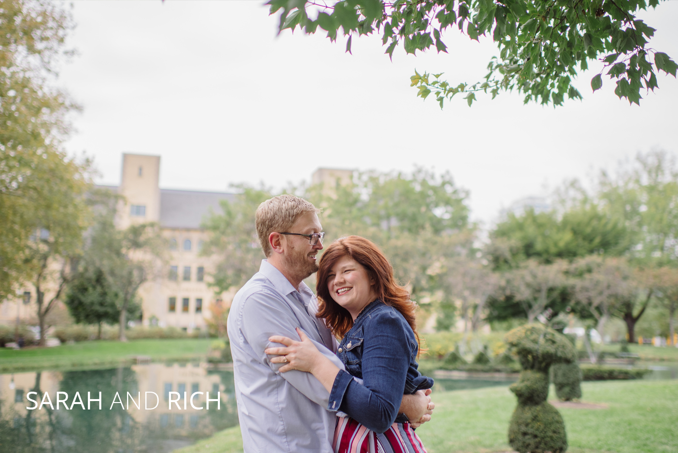 sarah and rich hugging in the topiary park