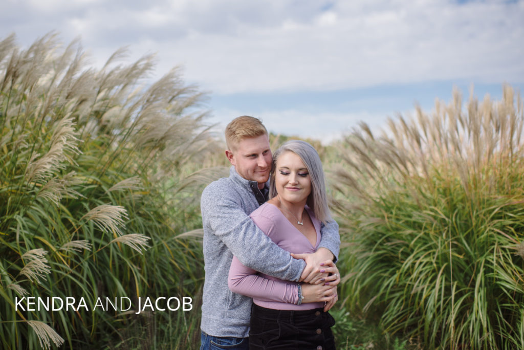 Kendra jacob | Jessica Miller Photography kendra and jacob hug on tartan field golf course