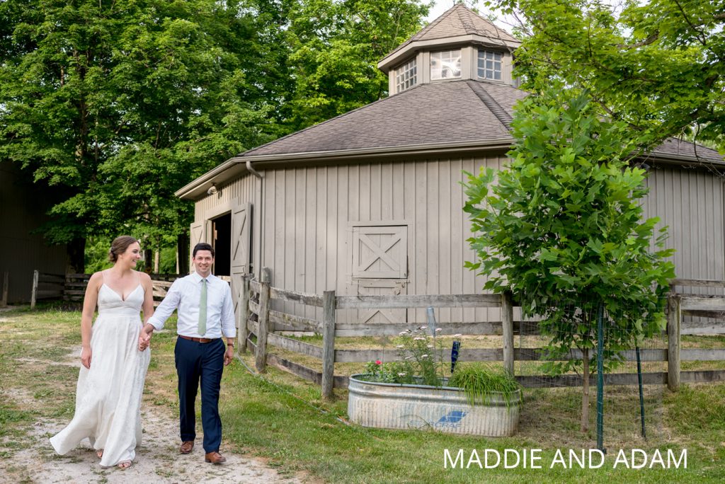 columbus horse farm wedding | Jessica Miller Photography bride and groom walk by horse barn