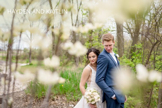 bride and groom hug in the spring